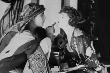 nitratediva:Rare candid footage of Rudolph Valentino goofing off with Agnes Ayres on the set of The Sheik. Part of me watches this and goes, “Shameless hussy!” The other part goes, “Well, yeah, that’s how I’d be acting around Rudy, too.”