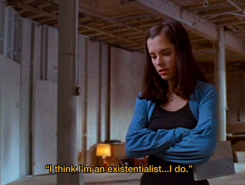  Screen shot from a "Party Girl" showing a young woman with crossed arms, and the subtitle, "I think I'm an existentialist...I do."