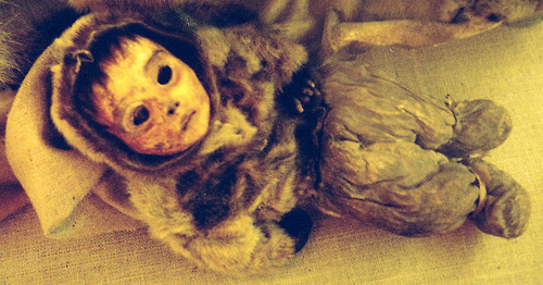 In 1972, eight remarkably preserved mummies were discovered at an abandoned Inuit settlement called Qilakitsoq, in Greenland. The "Greenland Mummies" consisted of a six-month old baby, a four year old boy, and six women of various ages, who died around 500 years ago. Their bodies were naturally mummified by the sub-zero temperatures and dry winds in the cave in which they were found.