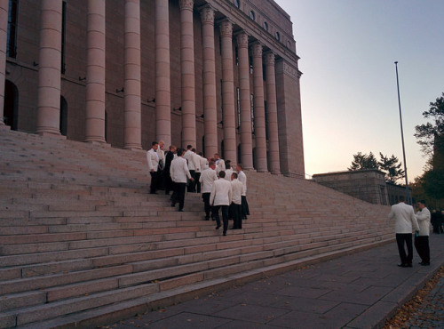 White suits on parliament steps