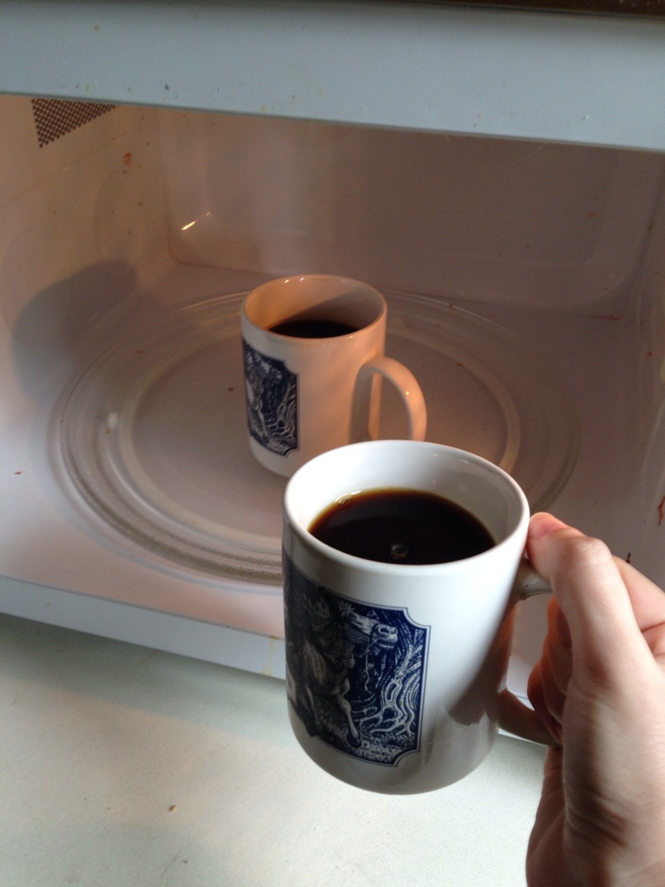 jokinglyartistic: So I went to go get some coffee but it was cold so I had to heat it up and when I opened the microwave I saw this. This is like some Twilight Zone shit. 2 Things you never warm up, never!Love and Coffee 
