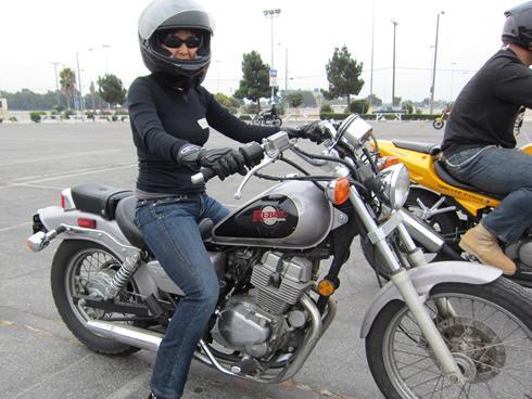 Babe dildoing on motorbike