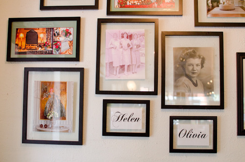 wall of photographs in frames