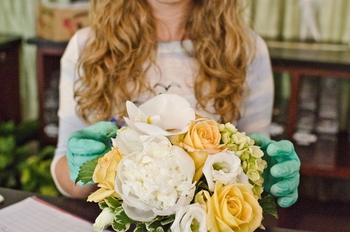 florist arranging flowers with hands