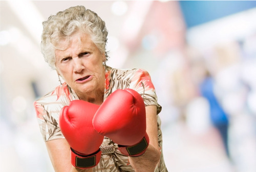 Topless mature boxing gloves