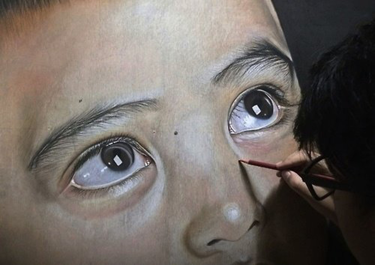 Ivan Hoos drawing of a young boy. (Ivan Hoo/Caters News)