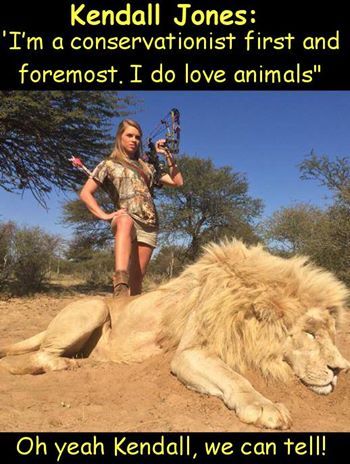 Woman hunter with dead giraffe
