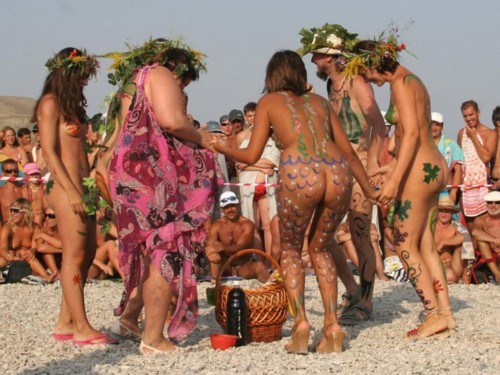Nude beach family body art